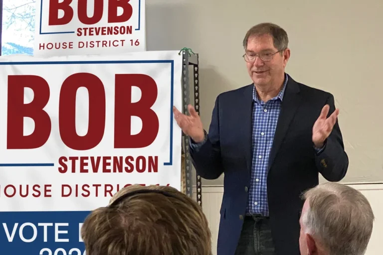 Bob stevenson speaking with group of supporters.