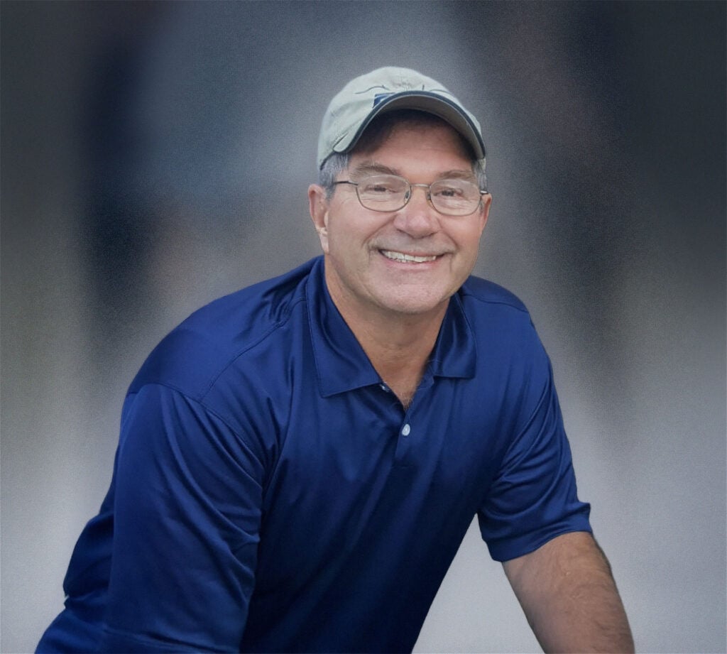 Bob stevenson in blue polo shirt and hat.